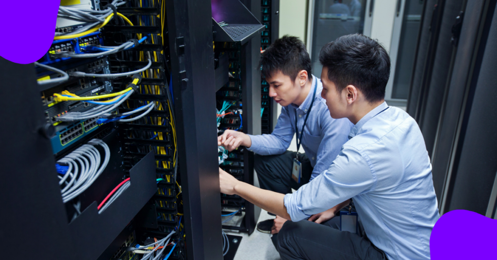 Two people working on game server infrastructure hardware layer